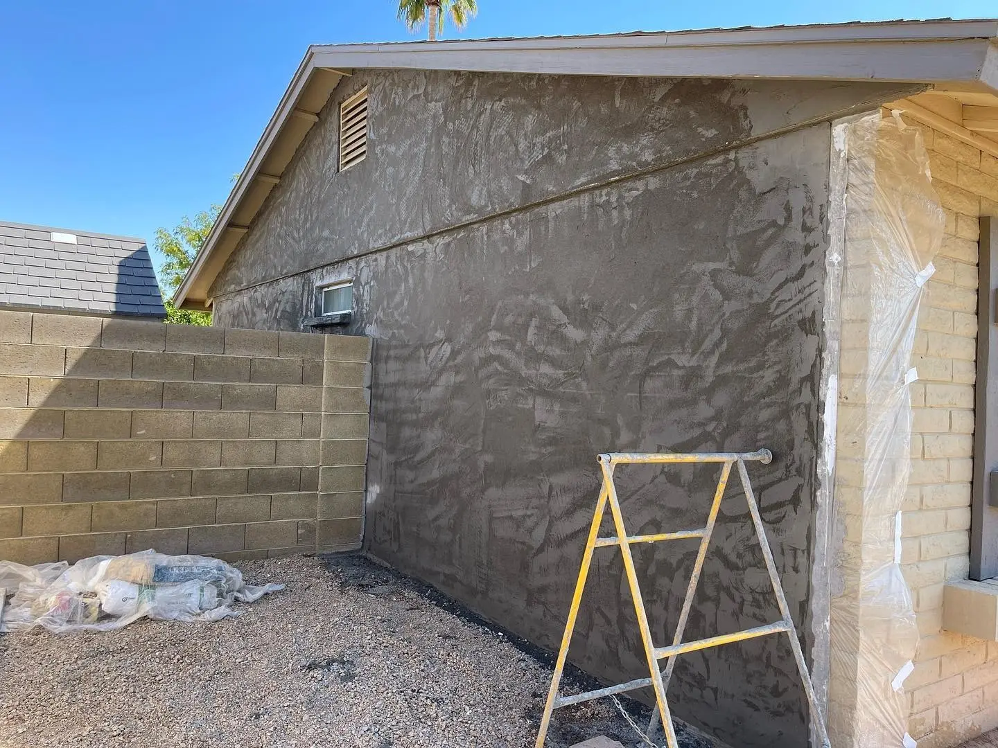 Freshly applied stucco coat on a home exterior wall in Arizona