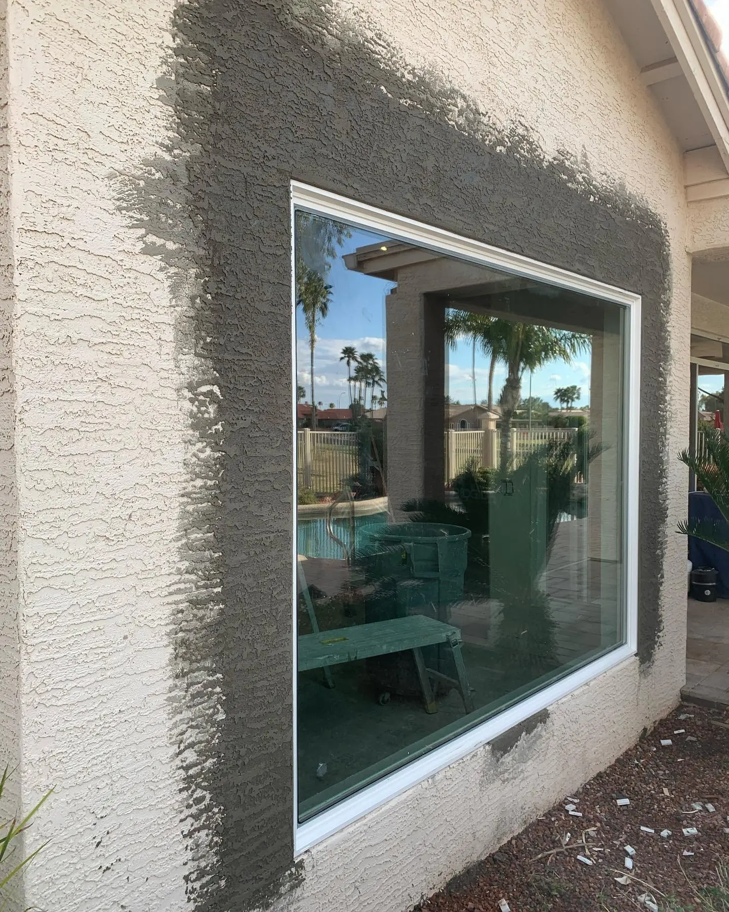 Re-stucco and window wrap with pool view