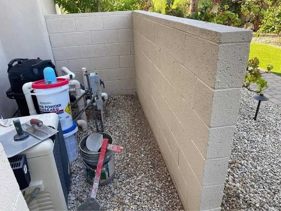 Coated masonry block wall